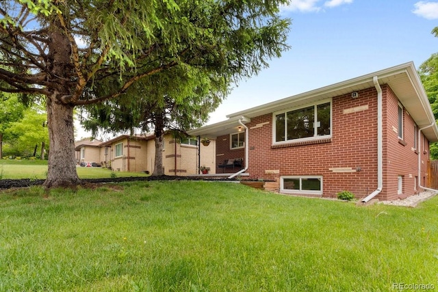 5185 N Meade St, Denver, CO 80221 - view of front facade with a front lawn and brick siding