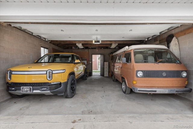 5185 N Meade St, Denver, CO 80221 - garage featuring concrete block wall and a garage door opener