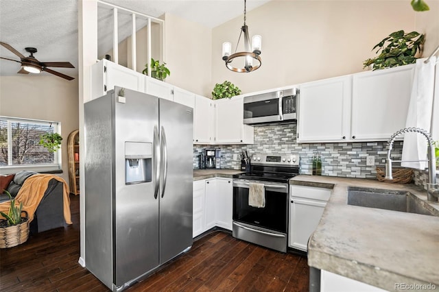 kitchen with white cabinetry, sink, and appliances with stainless steel finishes