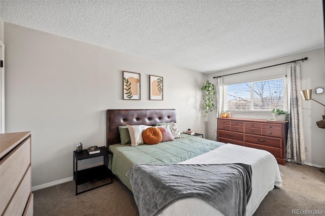 bedroom with carpet and a textured ceiling