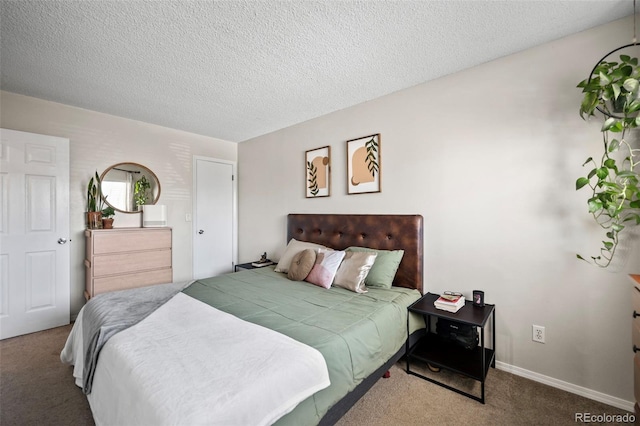 bedroom featuring carpet and a textured ceiling