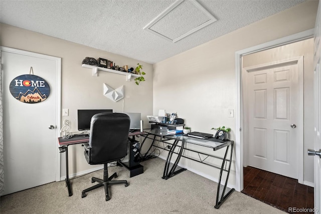 office area with a textured ceiling and hardwood / wood-style flooring