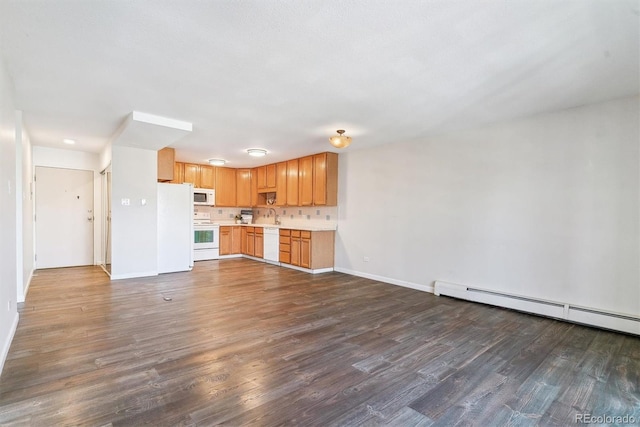 kitchen with a baseboard heating unit, baseboards, dark wood finished floors, light countertops, and white appliances