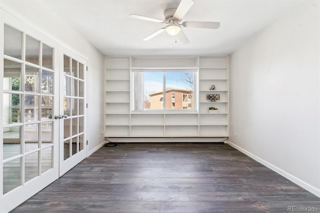 unfurnished room with french doors, a ceiling fan, baseboards, and wood finished floors