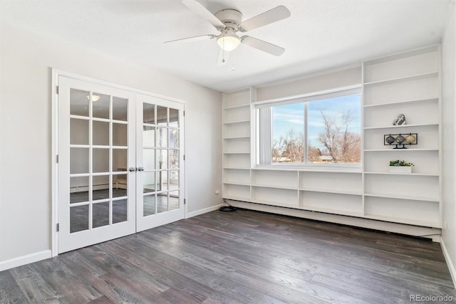 spare room with baseboards, ceiling fan, french doors, wood finished floors, and a baseboard radiator