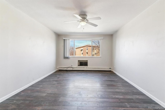 spare room with a baseboard radiator, wood finished floors, baseboards, and ceiling fan