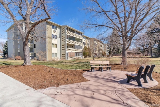 view of property's community with a lawn