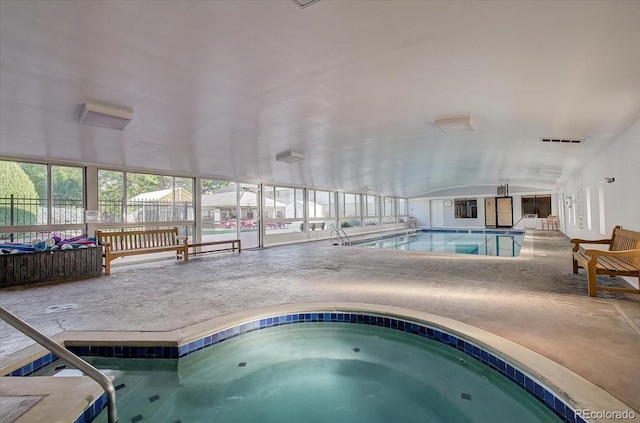 community pool featuring an indoor hot tub