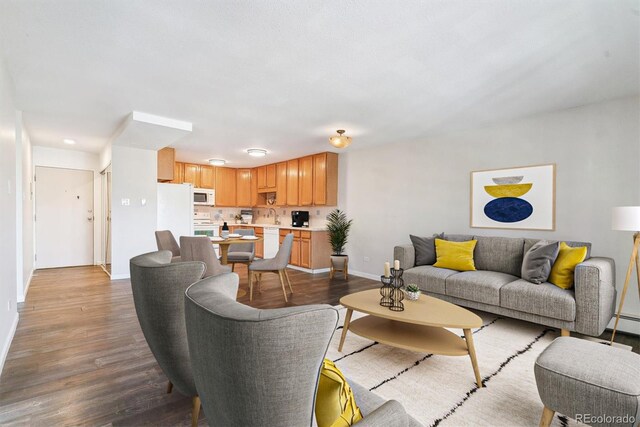 775 S Alton Way Unit 3C, Denver, CO 80247 - living area featuring baseboards and dark wood-style floors