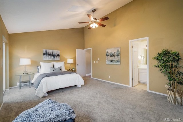 bedroom featuring a ceiling fan, high vaulted ceiling, baseboards, carpet flooring, and ensuite bath