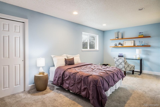 bedroom with baseboards, carpet, recessed lighting, and a textured ceiling