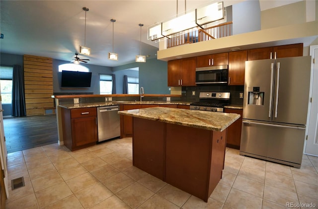 116 Timber Rd, Black Hawk, CO 80422 - kitchen with stainless steel appliances, plenty of natural light, ceiling fan, and light tile patterned flooring