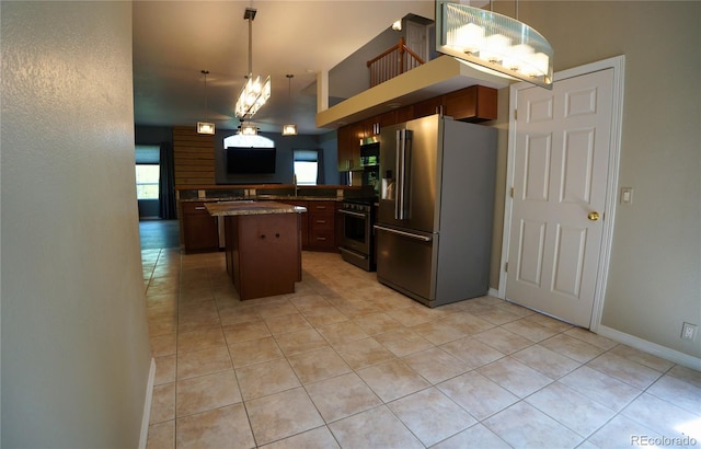 116 Timber Rd, Black Hawk, CO 80422 - kitchen featuring stainless steel appliances, light tile patterned flooring, a center island, and healthy amount of natural light
