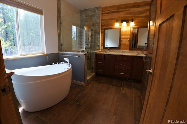 116 Timber Rd, Black Hawk, CO 80422 - full bathroom with a stall shower, double vanity, a freestanding tub, and wood finished floors
