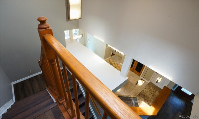 116 Timber Rd, Black Hawk, CO 80422 - staircase with wood finished floors and a high ceiling