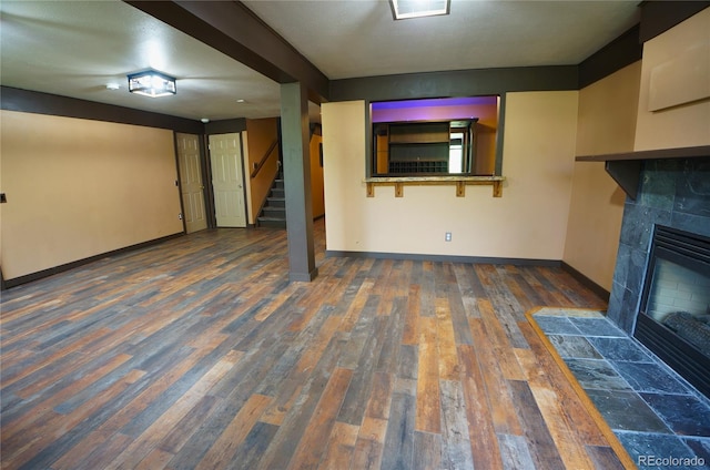 116 Timber Rd, Black Hawk, CO 80422 - unfurnished living room featuring stairway, wood finished floors, and a fireplace