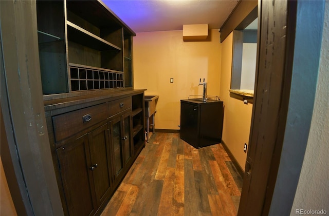116 Timber Rd, Black Hawk, CO 80422 - laundry room with dark wood-style floors and baseboards