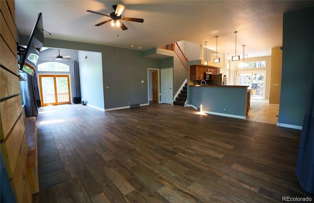 116 Timber Rd, Black Hawk, CO 80422 - unfurnished living room with a ceiling fan, stairs, and dark wood-style flooring