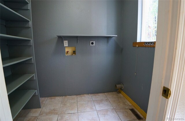 116 Timber Rd, Black Hawk, CO 80422 - laundry area with hookup for an electric dryer, hookup for a washing machine, and light tile patterned floors
