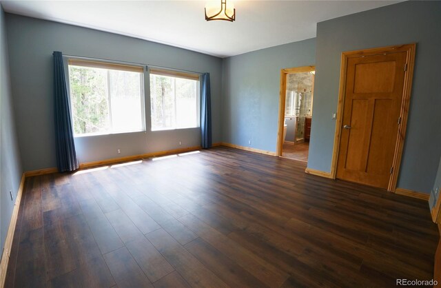 116 Timber Rd, Black Hawk, CO 80422 - unfurnished room with dark wood-style floors and baseboards