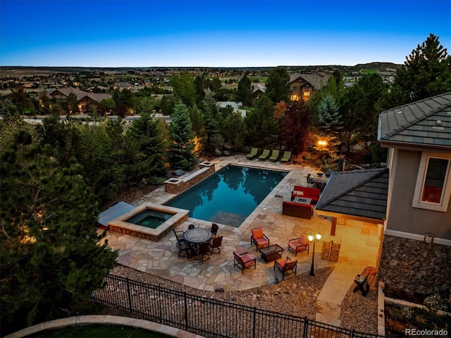 view of pool featuring an in ground hot tub and a patio area