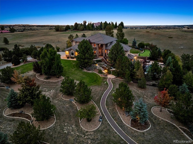 birds eye view of property with a rural view