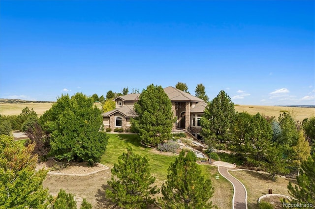 view of front of property with a rural view