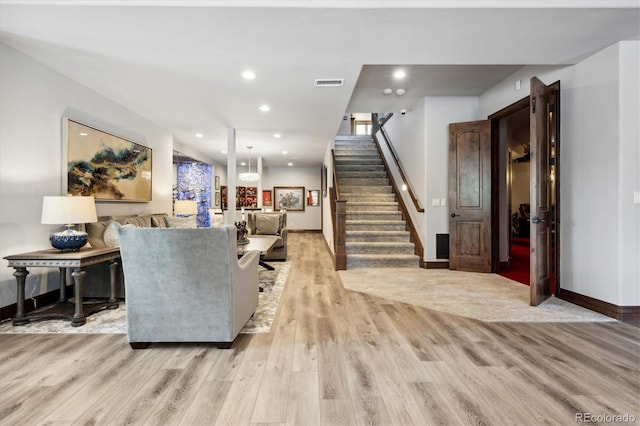 living room with light hardwood / wood-style flooring