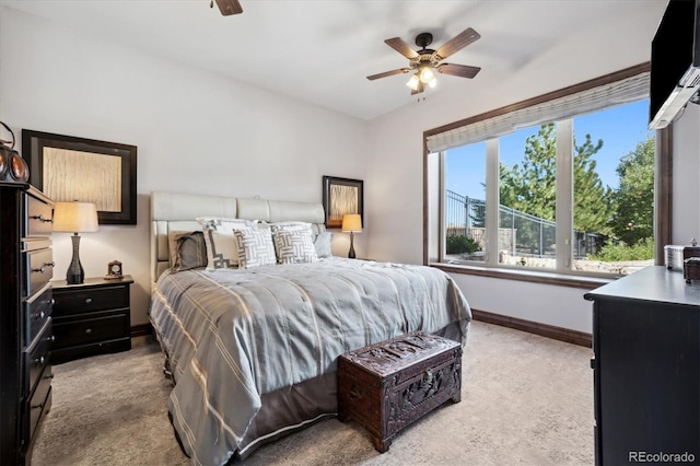 bedroom with light carpet and ceiling fan