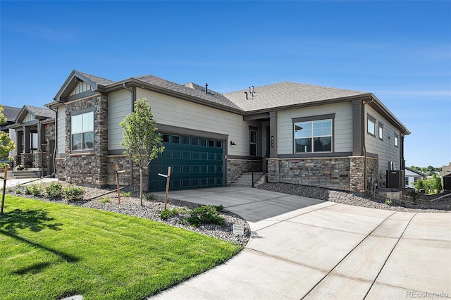 811 W 128th Pl, Westminster, CO 80234 - view of front of property featuring a garage, driveway, stone siding, and a front lawn