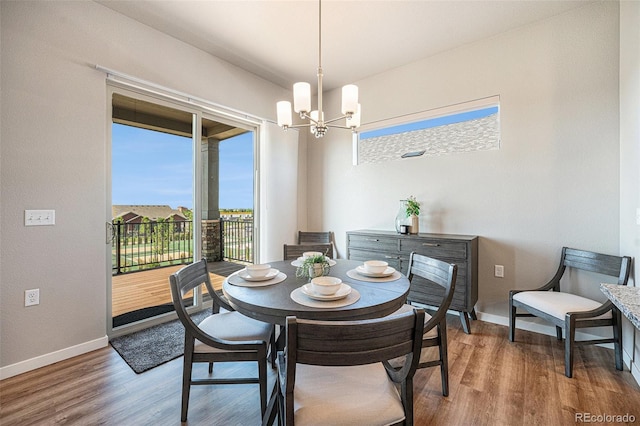 811 W 128th Pl, Westminster, CO 80234 - dining space with a chandelier and wood finished floors