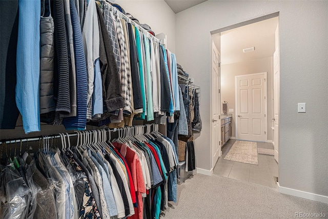 811 W 128th Pl, Westminster, CO 80234 - spacious closet featuring tile patterned flooring and carpet