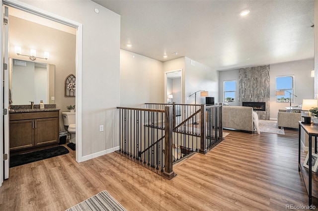 811 W 128th Pl, Westminster, CO 80234 - hall with an upstairs landing, light wood-type flooring, and recessed lighting