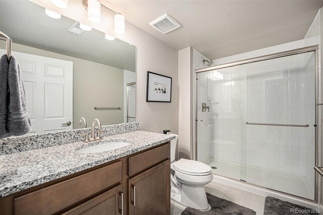 811 W 128th Pl, Westminster, CO 80234 - full bath with a shower stall, vanity, and tile patterned flooring