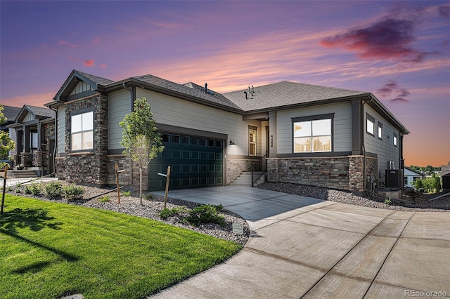 811 W 128th Pl, Westminster, CO 80234 - ranch-style house with stone siding, driveway, an attached garage, and a front yard