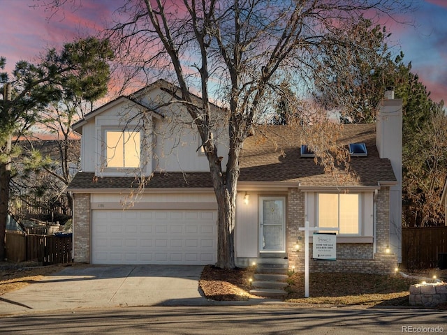 view of front of property with a garage