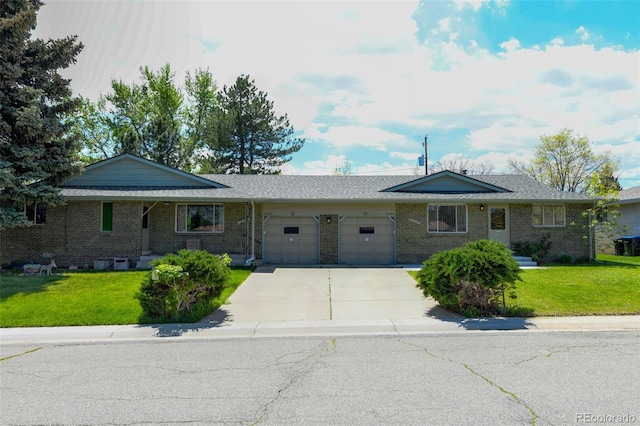 10560 W 63rd Ave, Arvada, CO 80004 - single story home with an attached garage, concrete driveway, a front yard, and brick siding