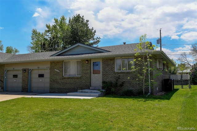 10560 W 63rd Ave, Arvada, CO 80004 - view of front of home with brick siding, a garage, a front yard, driveway, and a shingled roof
