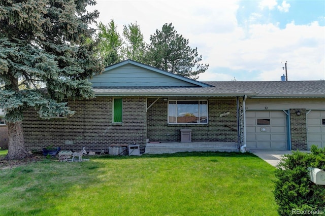 10560 W 63rd Ave, Arvada, CO 80004 - view of front of house featuring an attached garage, brick siding, a front lawn, and roof with shingles