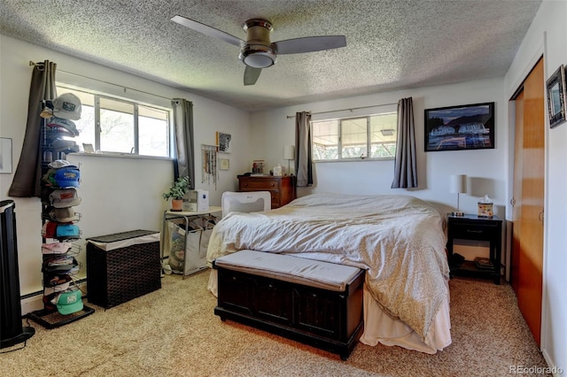 10560 W 63rd Ave, Arvada, CO 80004 - carpeted bedroom with a textured ceiling and ceiling fan