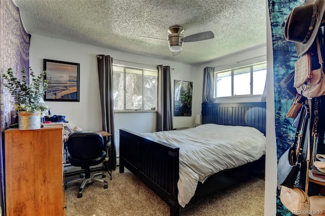 10560 W 63rd Ave, Arvada, CO 80004 - bedroom with a textured ceiling, carpet flooring, an office area, and ceiling fan