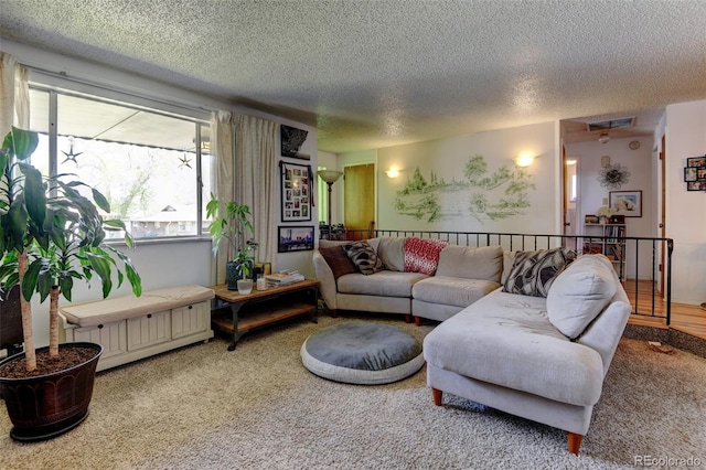 10560 W 63rd Ave, Arvada, CO 80004 - living area featuring a textured ceiling, carpet flooring, and plenty of natural light