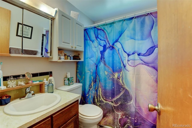 10560 W 63rd Ave, Arvada, CO 80004 - full bathroom featuring toilet, vanity, and curtained shower