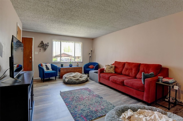 10560 W 63rd Ave, Arvada, CO 80004 - living area featuring wood finished floors and a textured ceiling