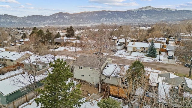 snowy aerial view with a mountain view