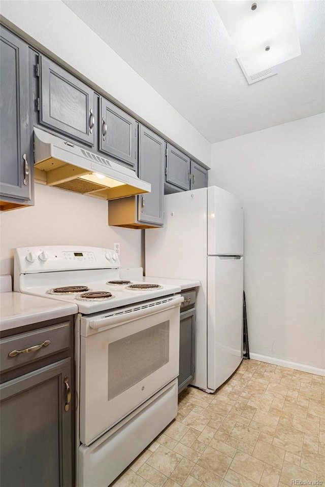 kitchen featuring white appliances and gray cabinetry