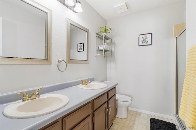 bathroom with toilet, an enclosed shower, and vanity