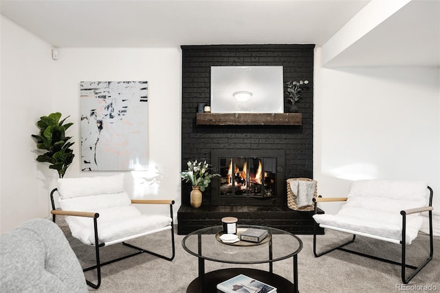 carpeted living room featuring a brick fireplace