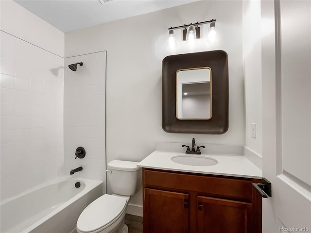 bathroom featuring vanity, bathtub / shower combination, and toilet