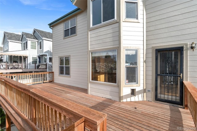 wooden deck featuring a residential view